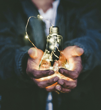 Man holding light bulb